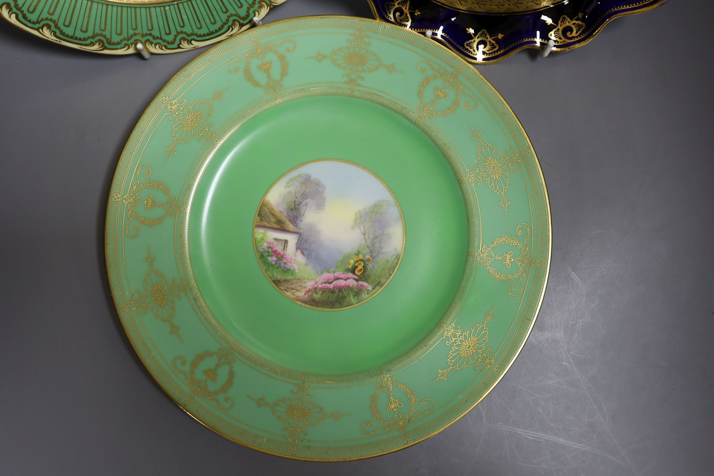 Four English porcelain topographical painted plates, to include Coalport, Royal Worcester and a similar (5)